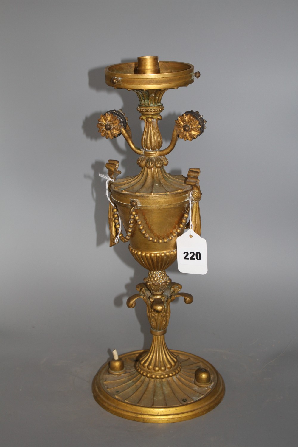 An early 20th century ormolu light fitting, lacking glass shade, height 41cm